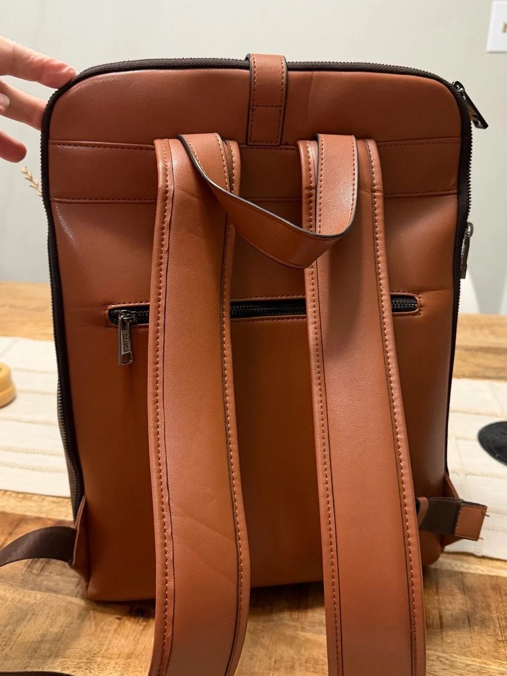 Cluci laptop Backpack with Crescent Pattern and different pockets.
